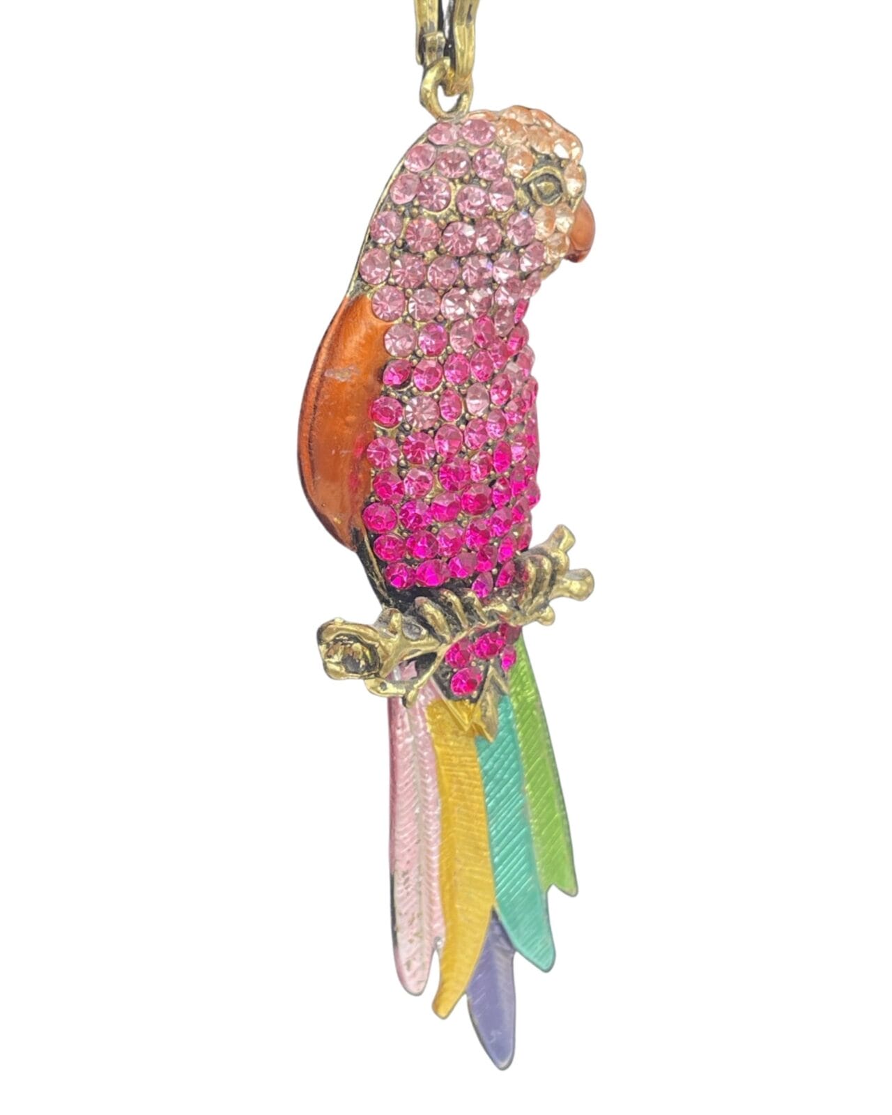 An Elegant Pink Rhinestone Parrot Pendant Necklace with Silver Chain is sitting on a gold chain.