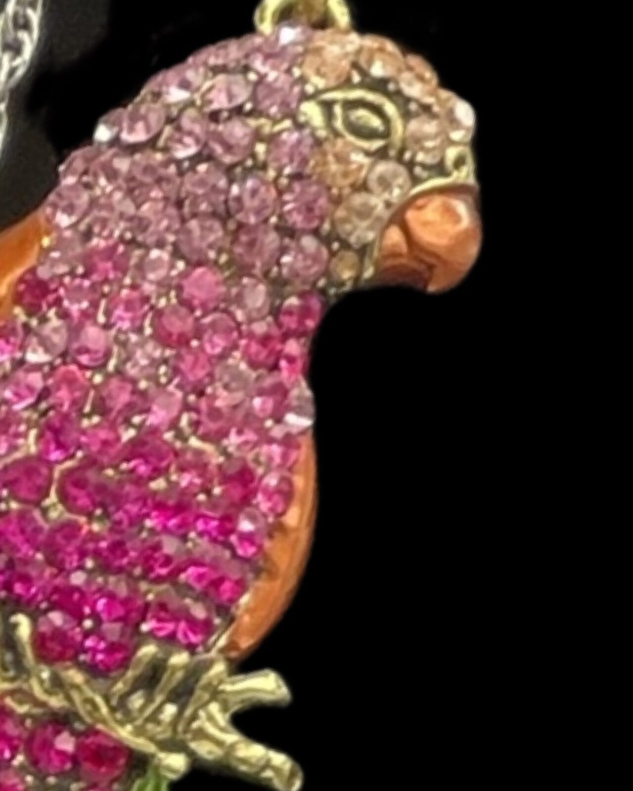 An Elegant Pink Rhinestone Parrot Pendant Necklace with Silver Chain.