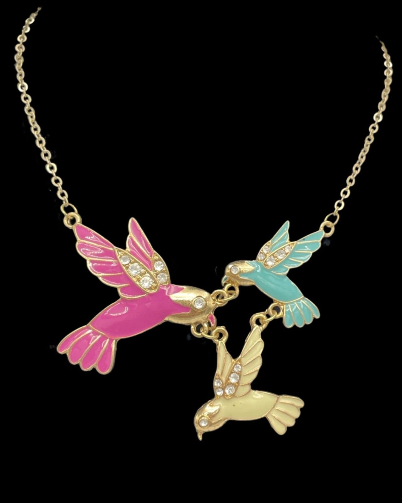 An Enchanting Enamel Trio of Hummingbirds necklace with rhinestones.